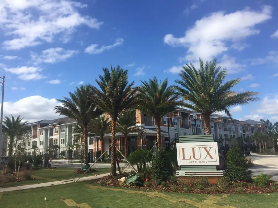 A view of the lux apartments from across the street.